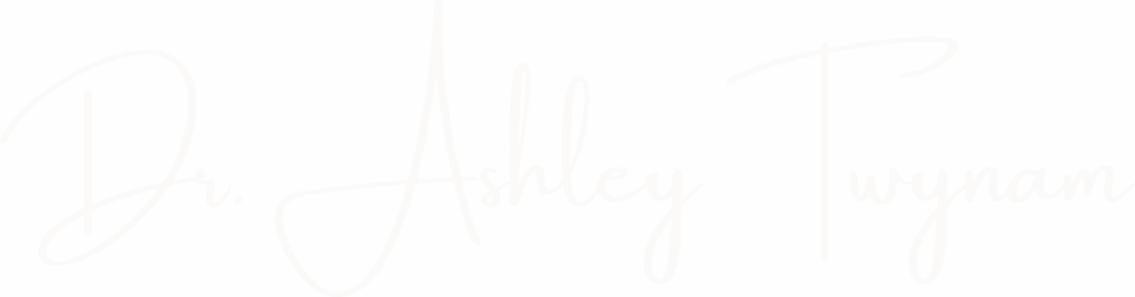 White handwritten logo of Dr. Ashley Twynam on transparent background, representing her coaching brand and signature presence.